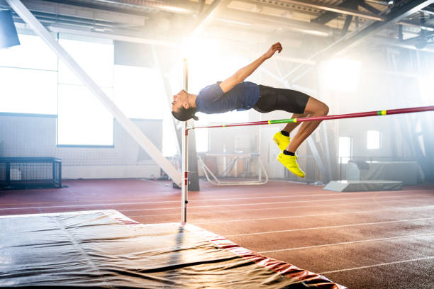 istock Sportsman high jumping through pole 1502674621