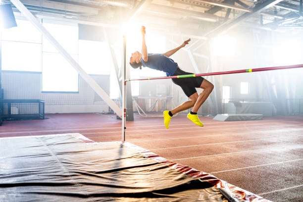 istock Sportsman high jumping through pole 1502674622