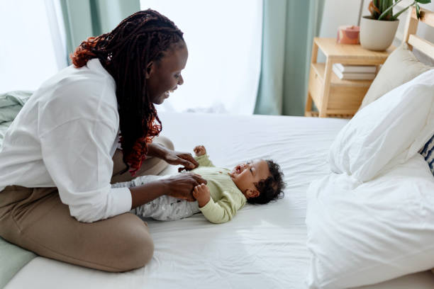 istock Mother enjoying with her little baby 1502674889