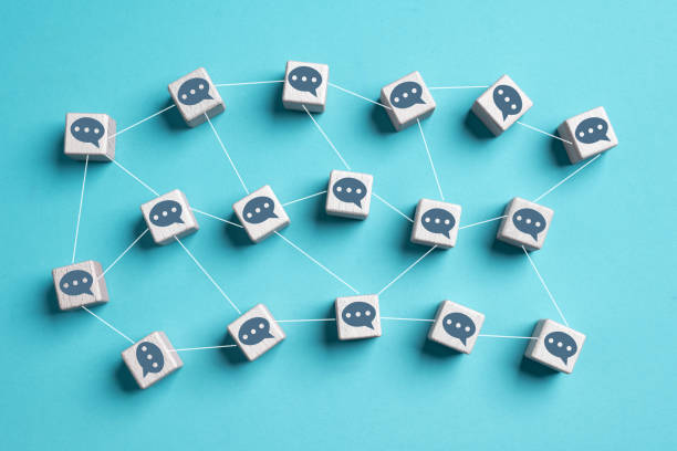 istock Wooden cubes with texting message chat link speech bubble each other on blue background. Online communication and social media  networking concept. Community and business remote working meeting theme. 1502675238