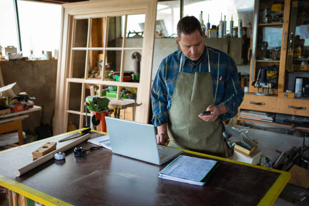 istock Carpenter working in his workshop.Small business owner. 1502677378