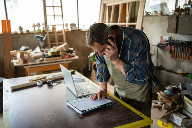 istock Carpenter working in his workshop.Small business owner. 1502677388