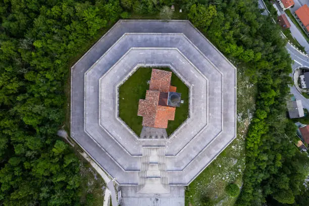 Photo of Drone view of St Anton Church and Kobarid Ossuary in Slovenia. Caporetto Memorial from First World War