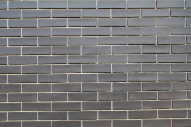 istock Black and grey brick wall texture interior or exterior design backdrop, vintage dark tone. Blank copy space. 1502681868