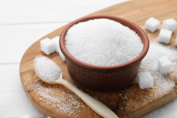 istock Different types of sugar on white wooden table, closeup 1502698359