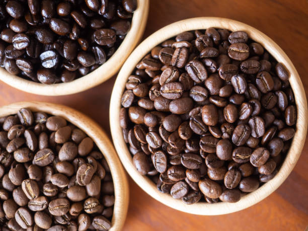 istock brown arabica coffee bean roast 3 level medium to dark different taste seed caffeine espresso drink food cafe beverage Chiang Rai, Thailand coffee on wooden table background top view selected focus 1502700026