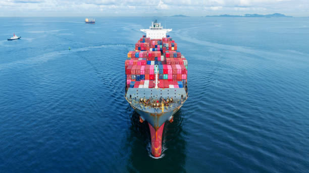 istock Cargo container Ship, cargo maritime ship with contrail in the ocean ship carrying container and running for export concept technology freight shipping sea freight by Express Ship. front view 1502702699