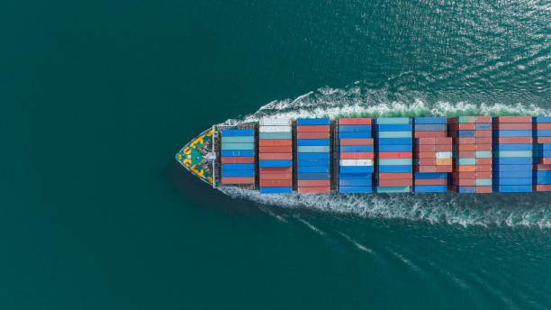 istock Aerial top view Cargo Ship carrying container and running for export goods from cargo yard port to other ocean concept freight shipping ship . 1502703000