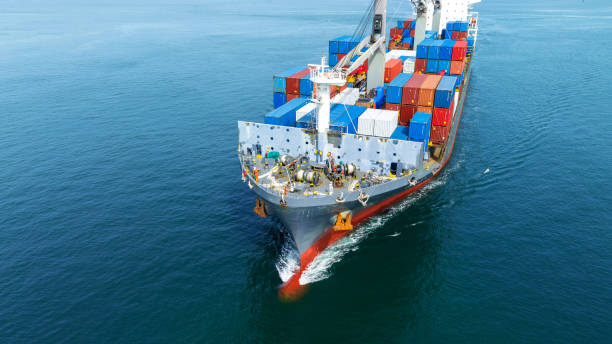istock Cargo container Ship, cargo maritime ship with contrail in the ocean ship carrying container and running for export concept technology freight shipping sea freight by Express Ship. front view 1502703087