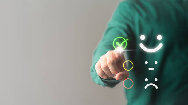 istock Client touches the virtual screen on the happy smile face icon to give assessment satisfaction in service. Rating is very impressed. Business concept of customer service, testimonial and satisfaction. 1502705106