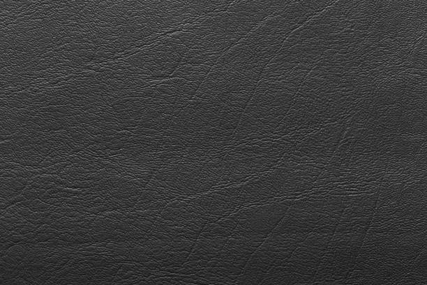 couro preto e um fundo texturizado. - car leather hide seat - fotografias e filmes do acervo