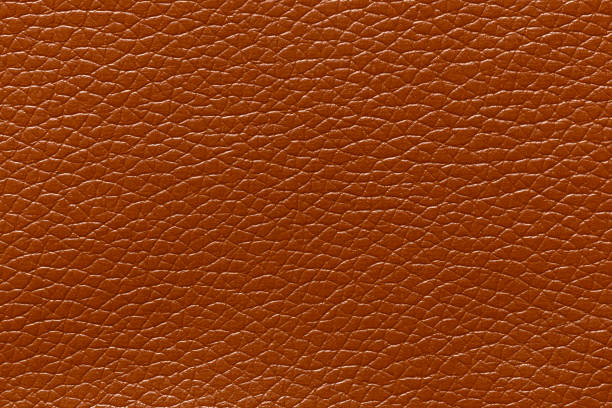 istock Brown leather and a textured background. 1502706181