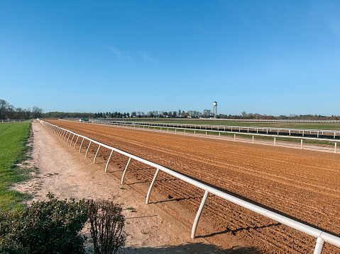 Wide Angle Mobile Device Photo of a Freshly Harrowed Dirt Horse Racing Track on a Sunny Spring Day