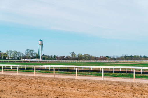 Wide Angle Photo of a Horse Racing Training Ranch Space with a Dirt Track and an Artificial All-Weather Track to Train Horses to Race in Steeplechase