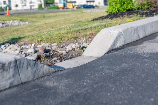 istock parking lot curbing cutout for stormwater drainage. 1502732785