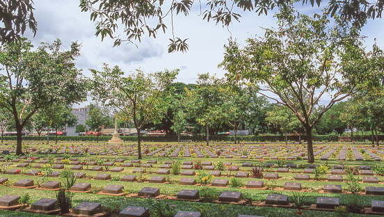 The beautifully tended Kanchanaburi War Cemetery in Thailand, associated with the Bridge on the River Kwai and the infamous Death Railway of World War Two, where some 7,000 POWs, who sacrificed their lives constructing the railway, are buried.
