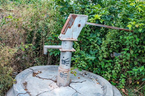 Pune, India - June 25 2023: A disused and abandoned water handpump outdoors at Pune India.