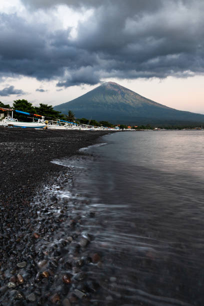 istock Black sand beach and mount Agung in Amed, Bali 1502735229
