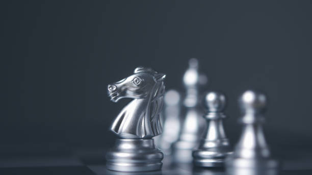 istock Silver horse chess encounters. Chess board game, business competitive. 1502744443