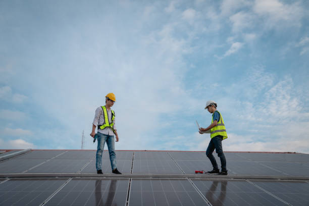 istock Service engineer checking solar cell on the roof for maintenance if there is a damaged part. Engineer worker install solar panel. Clean energy concept. 1502753958