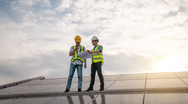 istock Service engineer checking solar cell on the roof for maintenance if there is a damaged part. Engineer worker install solar panel. Clean energy concept. 1502753970
