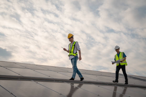 istock Service engineer checking solar cell on the roof for maintenance if there is a damaged part. Engineer worker install solar panel. Clean energy concept. 1502754495