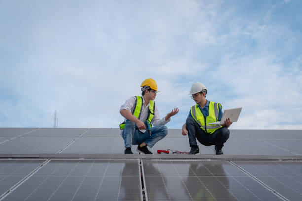 istock Service engineer checking solar cell on the roof for maintenance if there is a damaged part. Engineer worker install solar panel. Clean energy concept. 1502755018