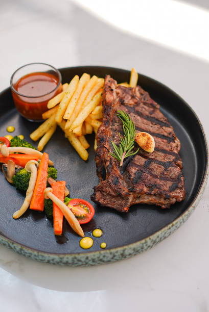 istock Beef Steak with Fried Fries, Vegetable Tomatoes and Sauce 1502763008