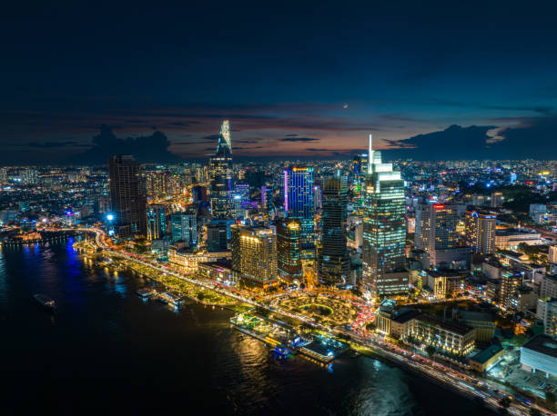 Drone view of District 1 by Sai Gon river in Ho Chi Minh city in sunset, South Vietnam