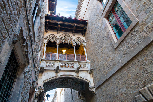 The Pont del Bisbe (Bishop Street Bridge), a Gothic bridge built in 1928 connecting the House of Canons with the Palau de la Generalitat in the Gothic Quarter of Barcelona, Spain.