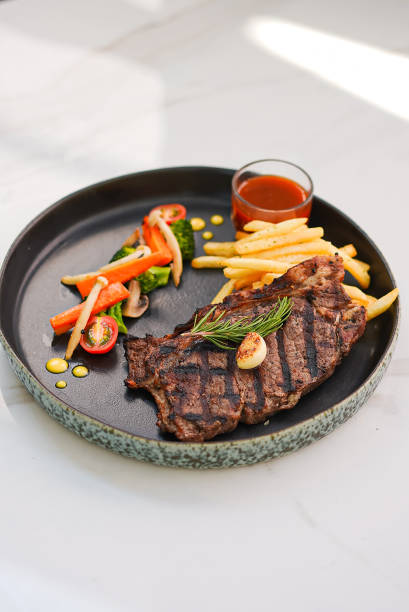 istock Beef Steak with Fried Fries, Vegetable Tomatoes and Sauce 1502765017