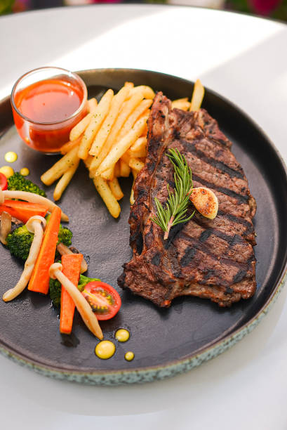 istock Beef Steak with Fried Fries, Vegetable Tomatoes and Sauce 1502765048