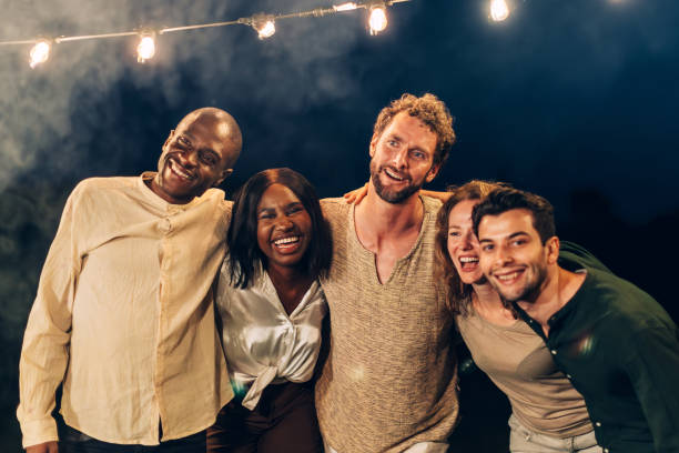 istock happy friends hugging each other at party 1502765418