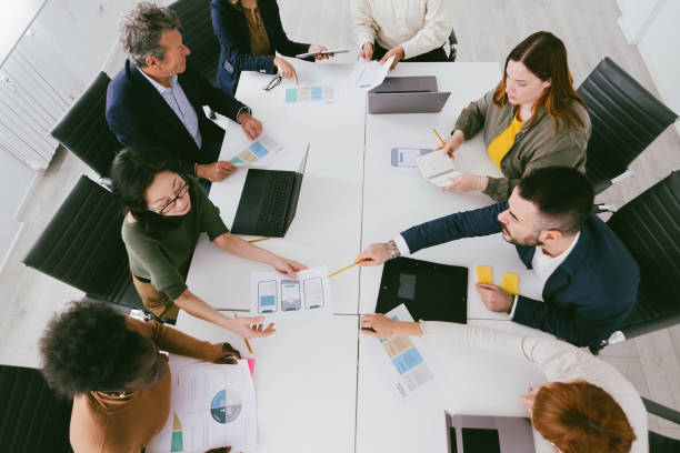 istock top view of team business at work together 1502765547