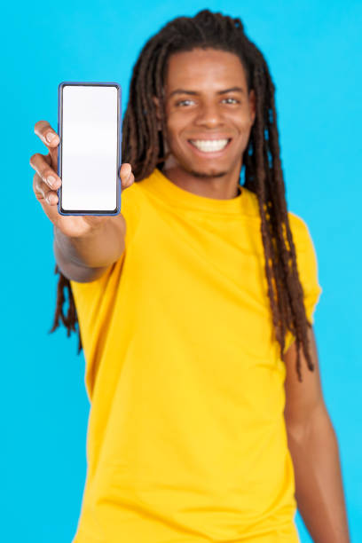 istock Blank screen of the mobile held by a latin man 1502767746