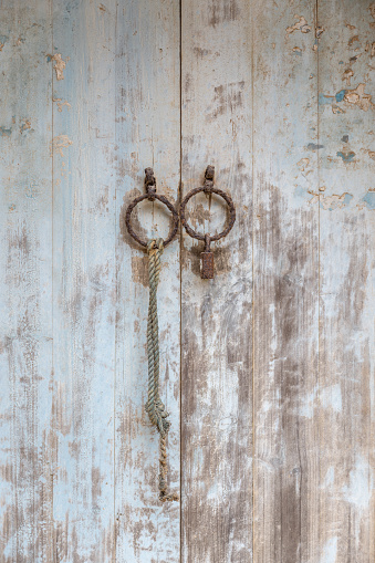 A close-up of a dilapidated and retro wooden door