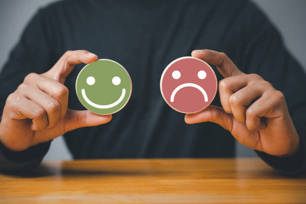 istock Selecting a smiley face on a wooden block circle 1502770369
