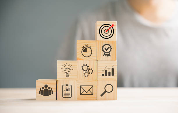 istock Wooden block cude step on table with Action Plan 1502770389