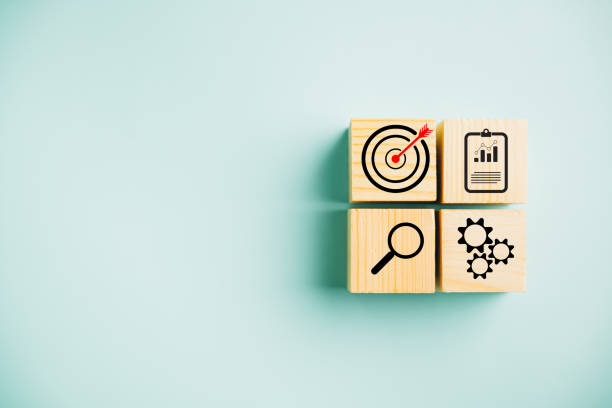 istock Wooden block cude step on table with Action Plan 1502770403