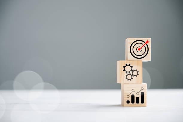 istock Wooden block cude step on table with Action Plan 1502770414