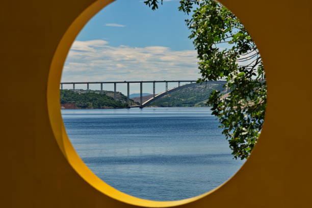 istock Arch bridge between the mainland and the island 1502772630