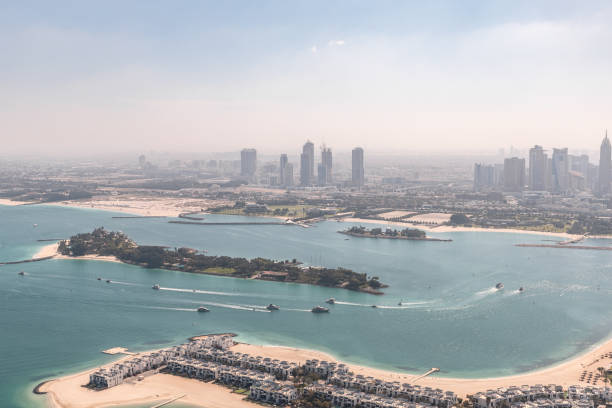 View from observation deck of the Nakheel Mall building to the Palm Jumeirah island and Dubai City in Dubai city, United Arab Emirates Dubai, United Arab Emirates, March 18, 2023 : View from observation deck of the Nakheel Mall building to the Palm Jumeirah island and Dubai City in Dubai city, United Arab Emirates dubai island stock pictures, royalty-free photos & images