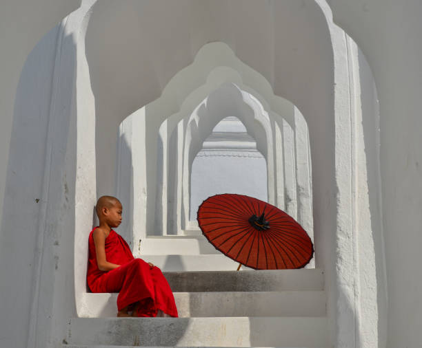 istock A Buddhist novice monk at white temple 1502775106