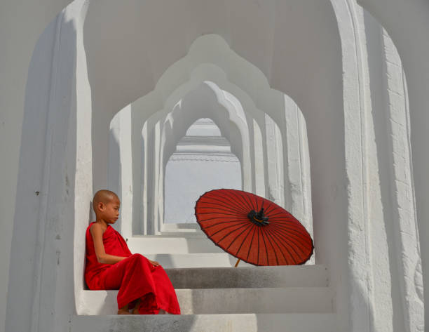 istock A Buddhist novice monk at white temple 1502775111