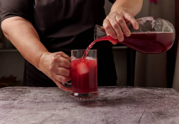 istock waitress dressed in black serving a pitcher of sparkling summer red wine on ice 1502776855