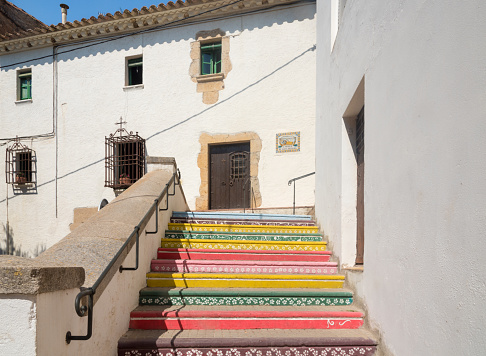 Colorful stairs in the old town of Begur, next to beaches in Girona, Catalonia.