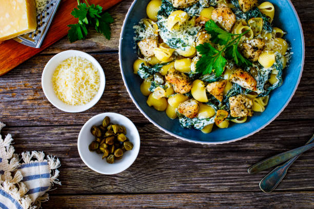 istock Noodles with seared chicken nuggets, spinach and parmesan 1502778453