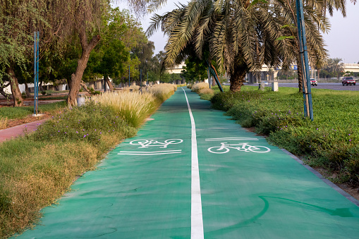 Bycycle lane in abu dhabi mussafah road. Bycycle road and workout place at open area in dubai - United Arab Emirates.