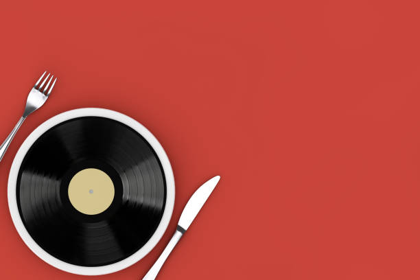istock Good Taste in Music Concept. Vinyl Disk on Plate with a Fork and a Knife. 3d Rendering 1502780376