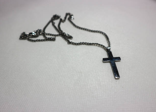 istock Cross necklace on a white background 1502780398